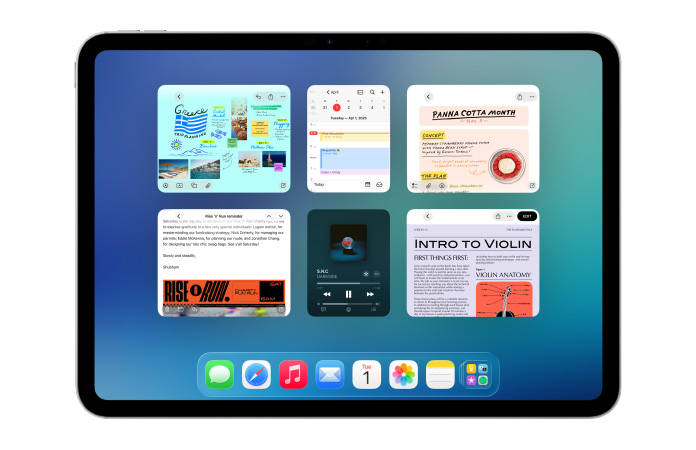 横屏放置的 iPad，屏幕展示日历和 Apple Music 等多款 app 以六个窗口的形式，排列成两行，均匀分布显示。
