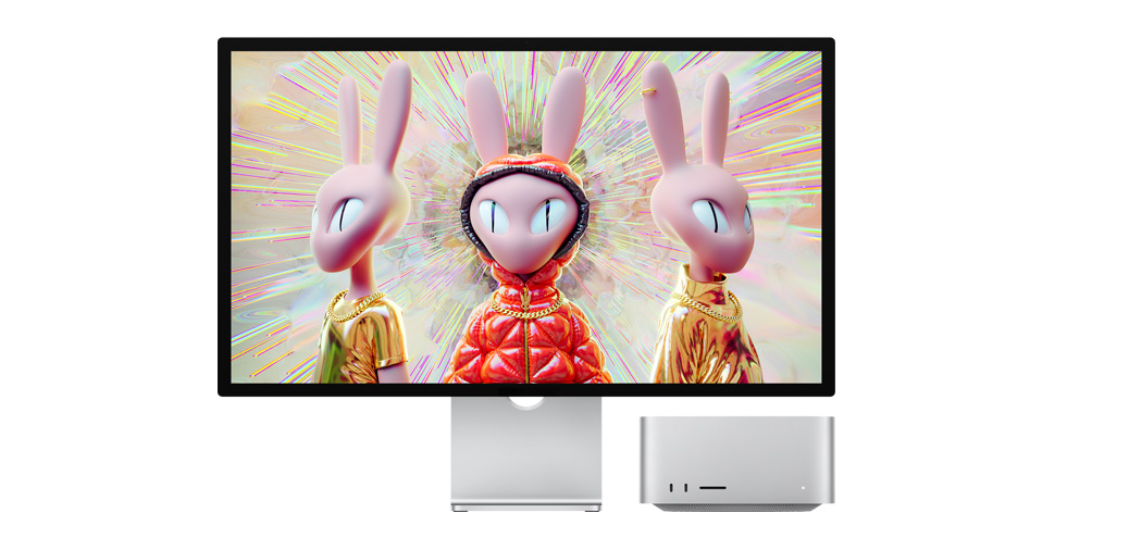 Mac Studio 和 Studio Display 并排放置，屏幕上展示三维人形兔形象图片。